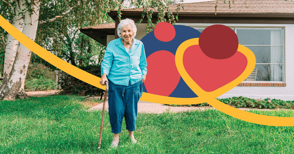 Elderly woman with a cane stands on grass in front of a house, with colorful abstract shapes in the background.