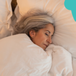 A senior woman with gray hair sleeping peacefully in a white bed, with graphic blue and teal shapes overlayed in the corners of the image.