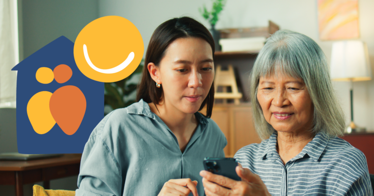 Young woman helping an older woman use a smartphone, with a care and companionship logo